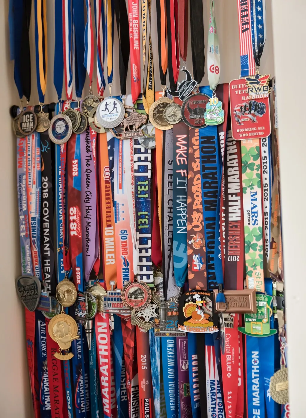 Krystalore Crews’ wall of marathon medals