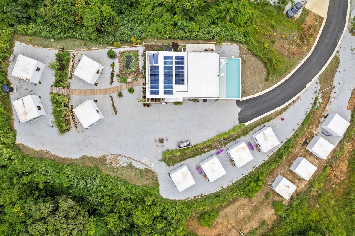 Aerial view of the 12-casita rainforest retreat property with pool in Ceiba Puerto Rico